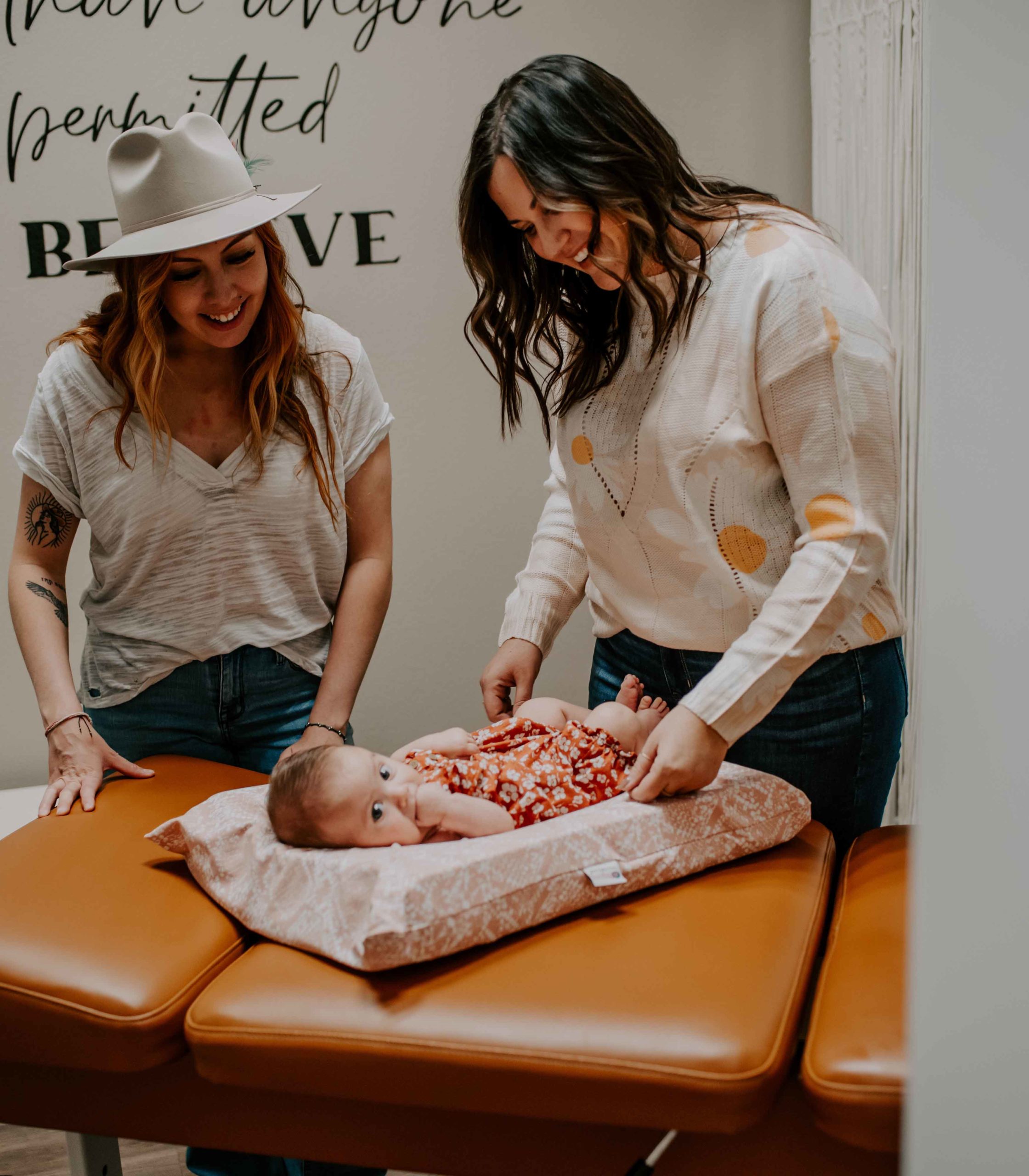 mother and infant receiving chiropractic care