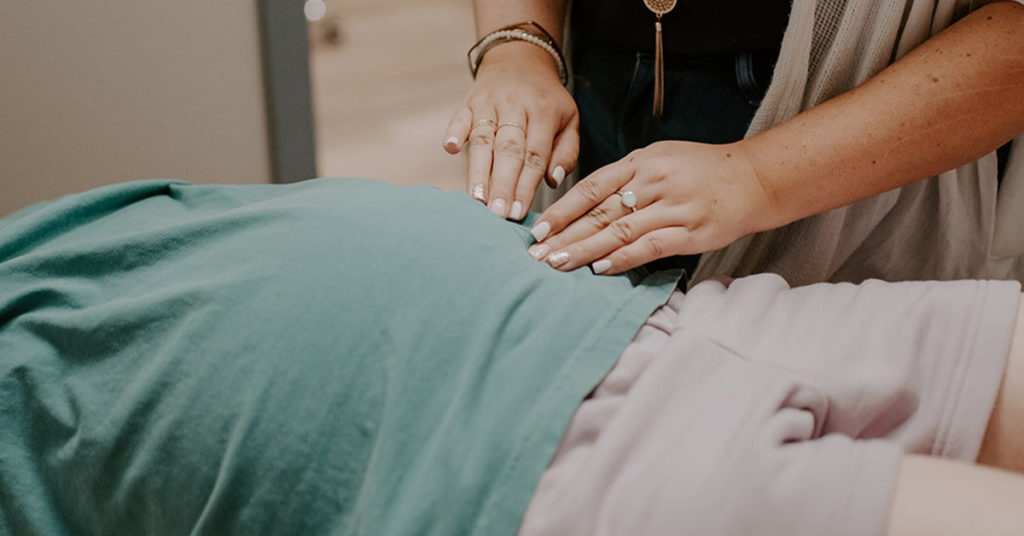 Pregnant woman getting a chiropractic adjustment
